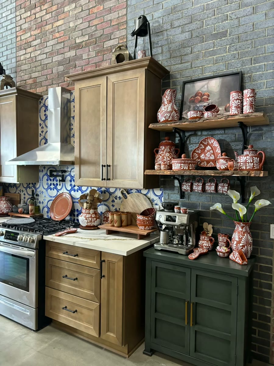 Talavera and barro pieces styled on a kitchen wall at Aitana's Collection