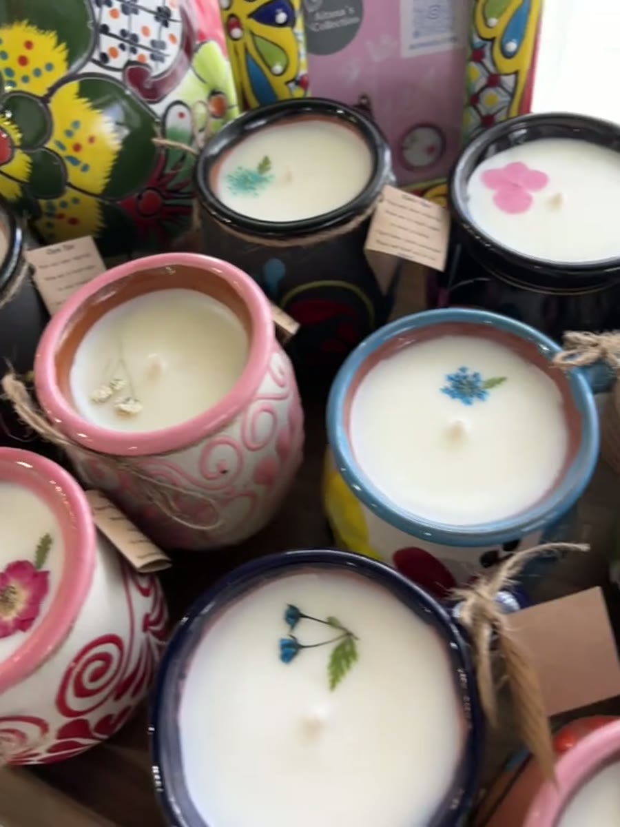 Handmade candles in clay cups